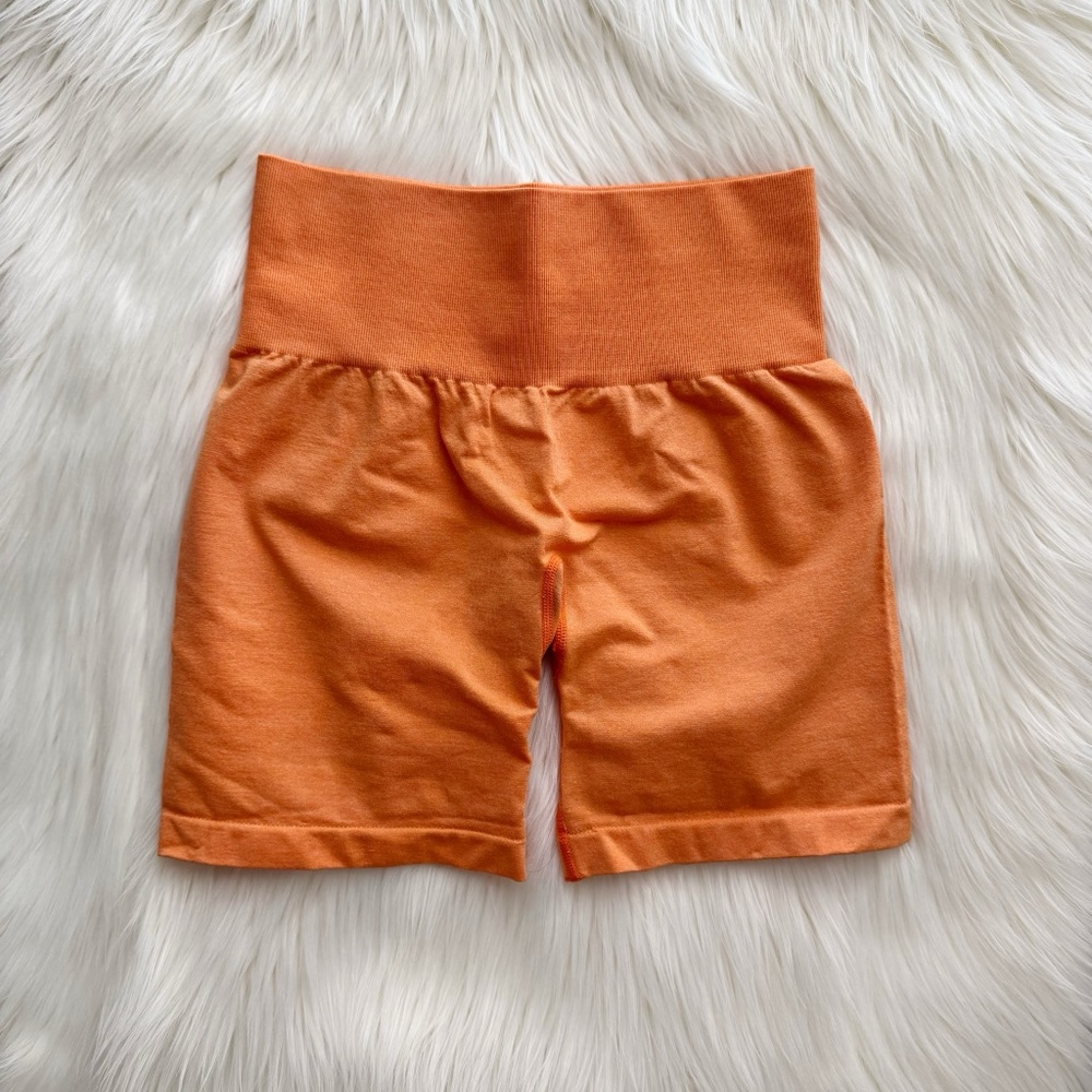 NVGTN sunset orange pro seamless shorts
